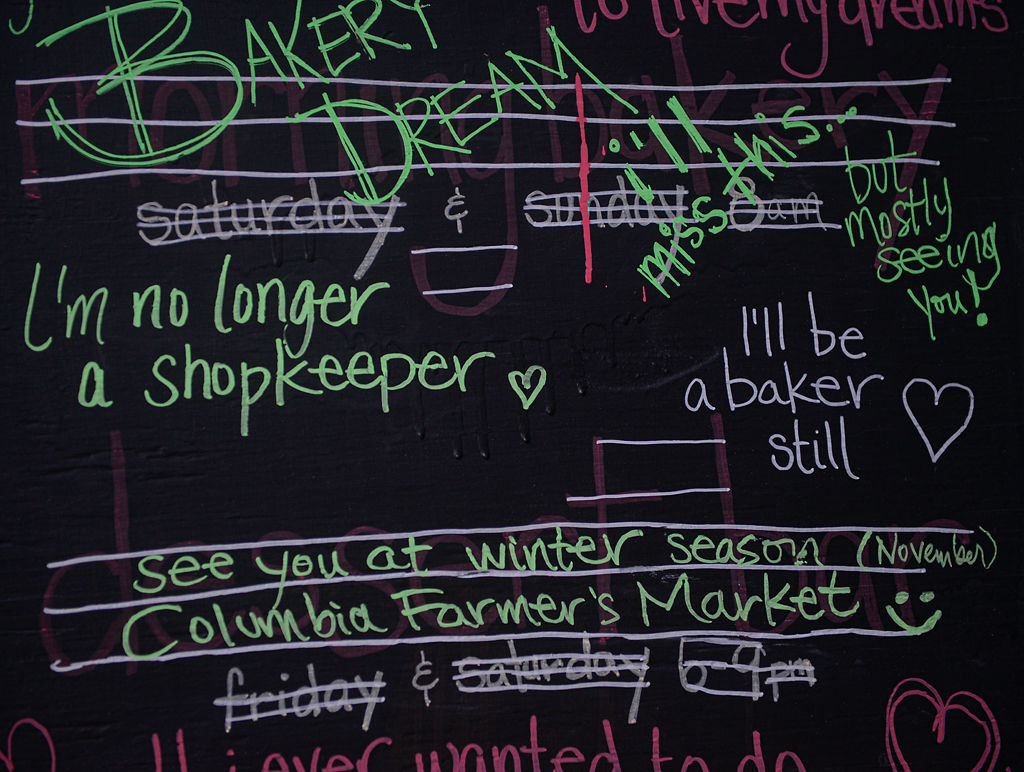 A chalkboard sign outside of Good Food Co.